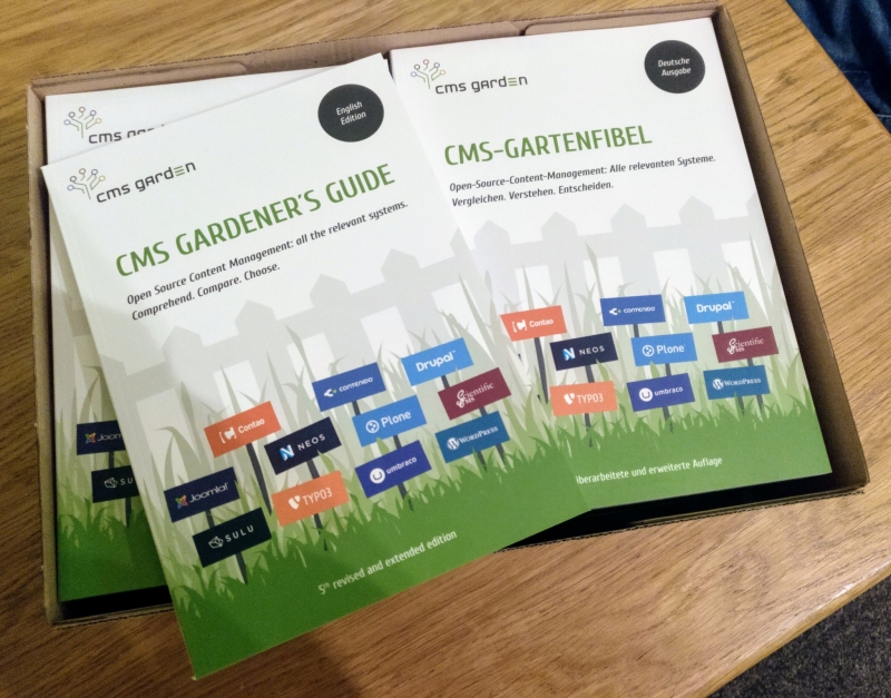 Photo of box with English front and German back covers of the CMS Gardener's Guide
